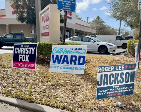Political signs on a street corner in West Palm Beach Florida.